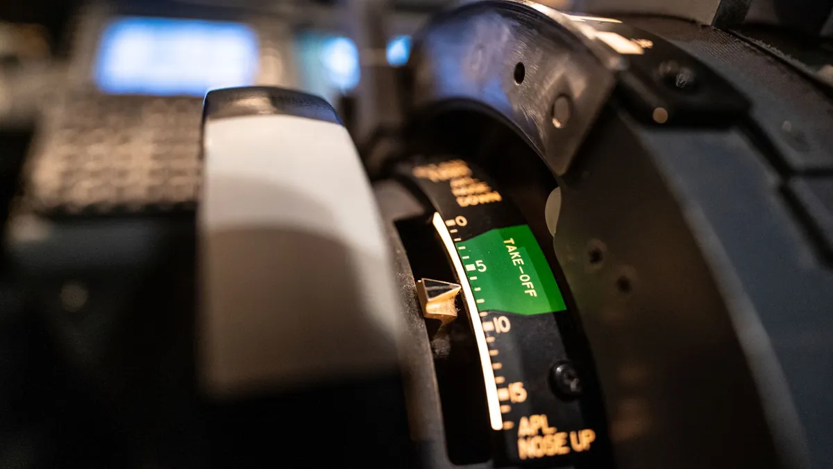 Close-up of aircraft throttle controls in a cockpit